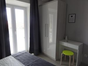 Postel nebo postele na pokoji v ubytování Apartmani Lara