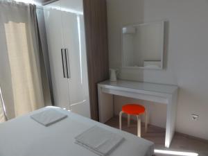 Postel nebo postele na pokoji v ubytování Apartmani Lara