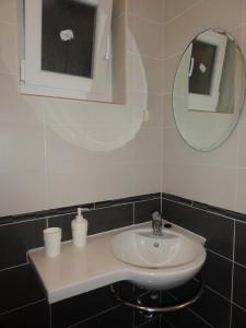 a bathroom with a sink and a mirror at Apartmani Anka in Gradac