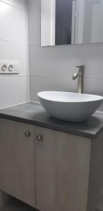 a white sink on a counter in a bathroom at Residentie Mercator All in Formule in Ostend