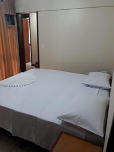 Cama ou camas em um quarto em Hotel Bela Vista