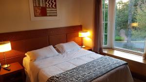 Ένα ή περισσότερα κρεβάτια σε δωμάτιο στο Espetacular Flat no Laje de Pedra - Mountain Village