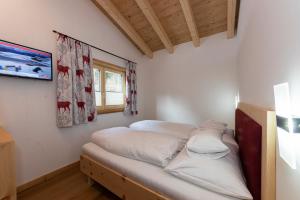 Postel nebo postele na pokoji v ubytování Chalet Glemmtal - Haus Bergblick