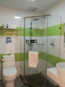 a bathroom with a shower and a toilet and a sink at 7Days Inn Guilin Qixing Road in Guilin