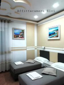 A bed or beds in a room at Affittacamere ELVI