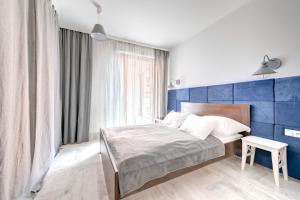 Cama ou camas em um quarto em 3 City Apartments - Admiralski