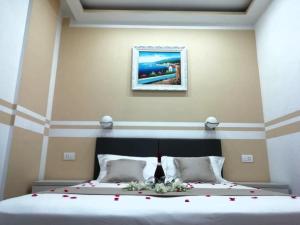 A bed or beds in a room at Affittacamere ELVI