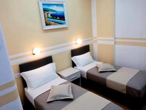 A bed or beds in a room at Affittacamere ELVI