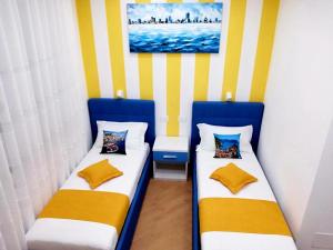 A bed or beds in a room at Affittacamere ELVI