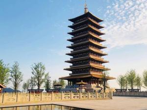 a large pagoda in the middle of a park at 7Days Inn Nanjing South Railway Station Jiangjun Avenue in Nanjing