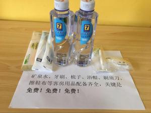 two bottles of water sitting on a piece of paper at 7Days Inn Yiyang victory road in Shangrao