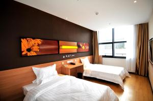 Posteľ alebo postele v izbe v ubytovaní 7Days Inn Suzhou Industrial Park Sheng Pu Tongjiang Road