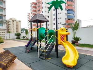 a playground with a slide and a play equipment at Prive Riviera - Apartamentos JN in Caldas Novas