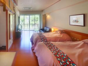 Ένα ή περισσότερα κρεβάτια σε δωμάτιο στο Kinugawa Onsen Hana no Yado Matsuya