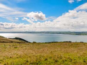 a view of a large lake in a field at Little Laight in Cairnryan