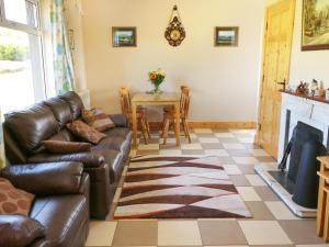 a living room with a couch and a table at Clash-Brack in Dungarvan