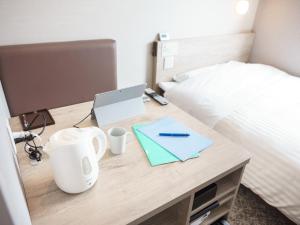 Postel nebo postele na pokoji v ubytování Super Hotel Saitama Kawagoe