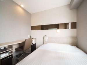 Postel nebo postele na pokoji v ubytování Super Hotel Saitama Kawagoe
