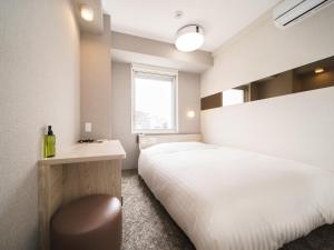 Postel nebo postele na pokoji v ubytování Super Hotel Saitama Kawagoe
