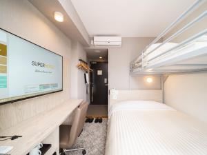 Postel nebo postele na pokoji v ubytování Super Hotel Saitama Kawagoe