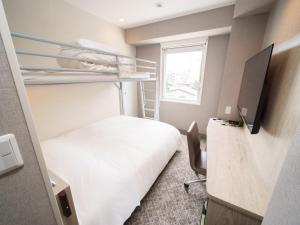 Postel nebo postele na pokoji v ubytování Super Hotel Saitama Kawagoe