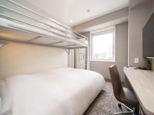 Postel nebo postele na pokoji v ubytování Super Hotel Saitama Kawagoe