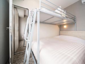 Postel nebo postele na pokoji v ubytování Super Hotel Saitama Kawagoe