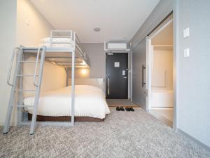 Postel nebo postele na pokoji v ubytování Super Hotel Saitama Kawagoe