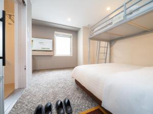 Postel nebo postele na pokoji v ubytování Super Hotel Saitama Kawagoe