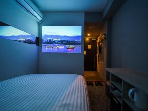 Postel nebo postele na pokoji v ubytování Super Hotel Saitama Kawagoe