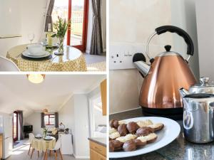 a kitchen with a tea kettle and a table with food at Little Acorn in Barnstaple +2 photos
