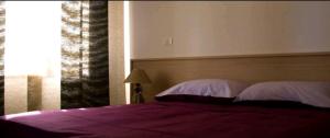 Posteľ alebo postele v izbe v ubytovaní Augusta Palm Apartment