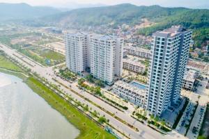 an aerial view of a city with tall buildings at Angela House Halong in Ha Long