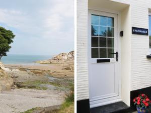 a door to a house with a view of the beach at Enginefield in Ilfracombe