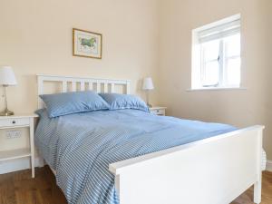 מיטה או מיטות בחדר ב-Granary 2
