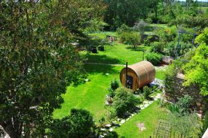 an aerial view of a garden with a barrel at Gte De Charme Le Cdre in Baron