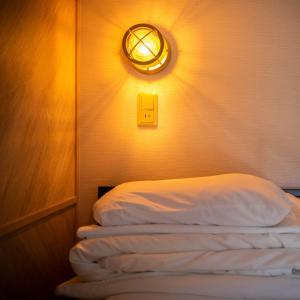 Voodi või voodid majutusasutuse Super Hotel Nagaizumi Numazu Inter toas