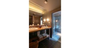a bathroom with two sinks and a shower at Ainotsuji Machiya House in Kanazawa +31 photos