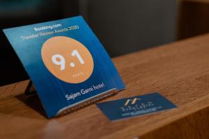 Certifikát, hodnocení, plakát nebo jiný dokument vystavený v ubytování Sajam Garni hotel