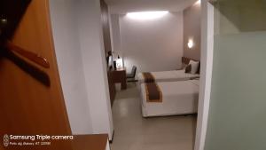 Postel nebo postele na pokoji v ubytování Xtra Hotel Bengkulu