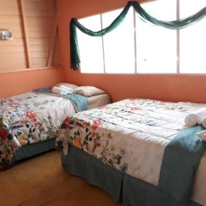 Postel nebo postele na pokoji v ubytování The Place to Enjoy Life