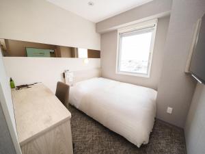 Postel nebo postele na pokoji v ubytování Super Hotel Saitama Kawagoe