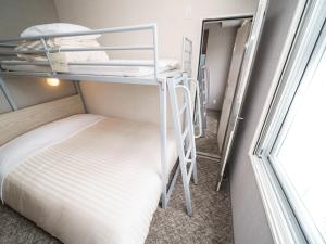 Postel nebo postele na pokoji v ubytování Super Hotel Saitama Kawagoe