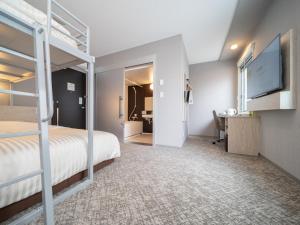 Postel nebo postele na pokoji v ubytování Super Hotel Saitama Kawagoe
