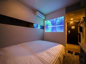Postel nebo postele na pokoji v ubytování Super Hotel Saitama Kawagoe