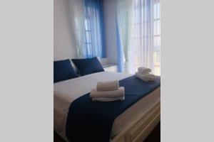 A bed or beds in a room at Pyrgi Spetses