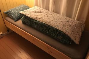 Posteľ alebo postele v izbe v ubytovaní Nordlandshus ved Lofotr