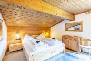 Posteľ alebo postele v izbe v ubytovaní Ferienhaus Sonnrain