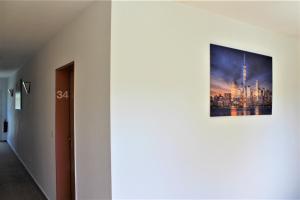 a picture of a city on a wall at Hotel Alsterquelle in Henstedt-Ulzburg