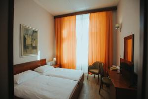 Postel nebo postele na pokoji v ubytování Hotel Central